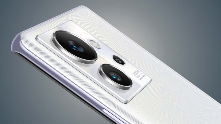 Close-up view of a white Infinix smartphone showcasing its triple rear camera module with a prominent 200MP lens and sleek patterned back design