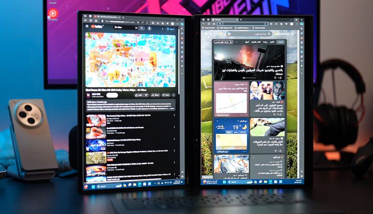 Dual-screen Asus laptop in vertical desktop mode displaying YouTube on the left screen and an Arabic news website on the right screen