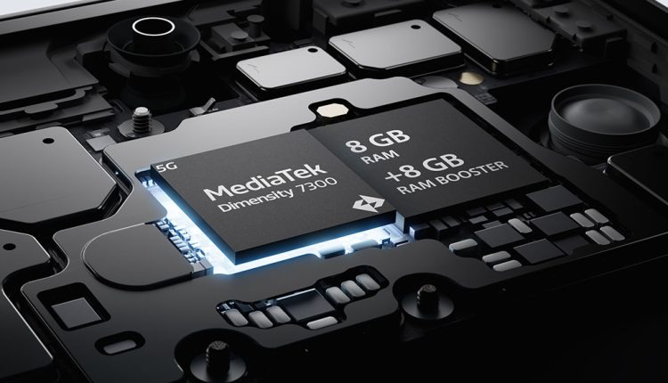 A detailed, close-up view of a circuit board with a glowing blue chip labeled "MediaTek Dimensity 7300 5G". Next to it, another chip is labeled "8 GB RAM +8 GB RAM BOOSTER". Various other electronic components are visible on the dark grey circuit board.